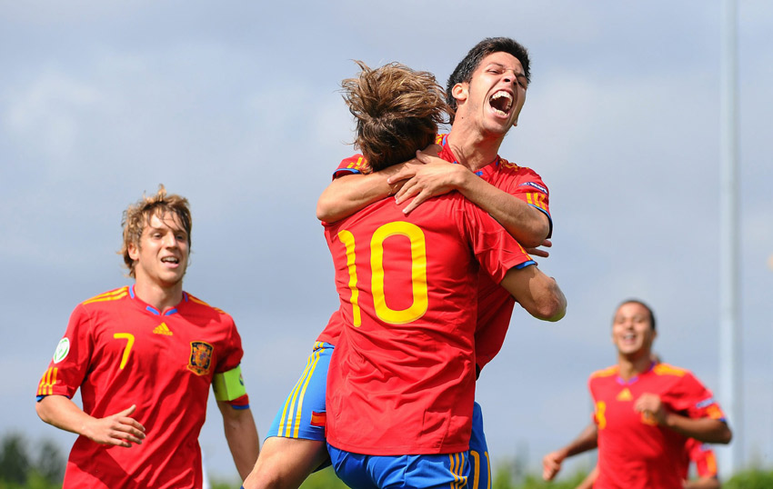 Daniel Pacheco celebrates with team-mate Sergio Canales (No.10) after opening the scoring against England.